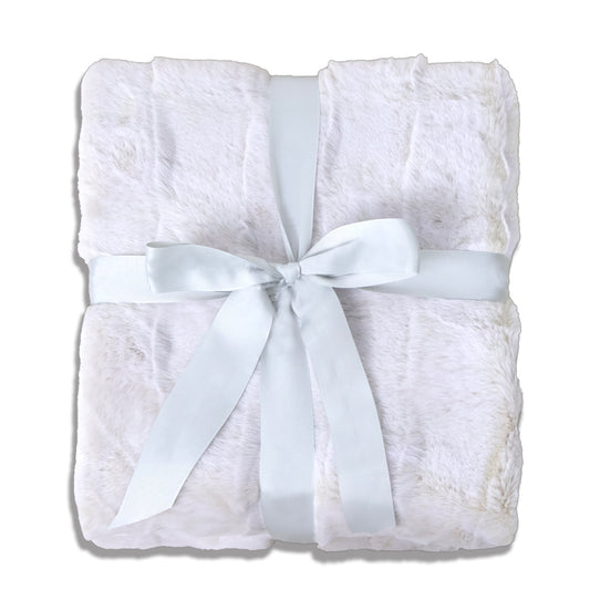 A folded white plush blanket with a soft, fluffy texture, adorned with a gray ribbon bow at the center. The clean white background highlights the item, creating an elegant and cozy atmosphere suitable for gift-giving or home decor.