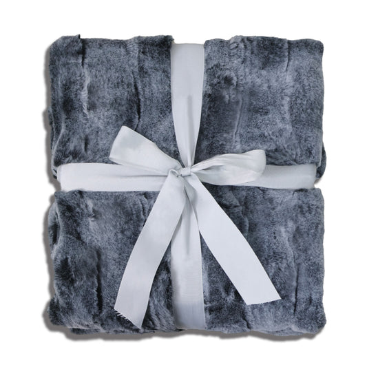 A neatly folded gray plush blanket with a soft, fluffy texture, elegantly wrapped with a wide white satin ribbon that crosses horizontally and vertically, tied into a bow at the center. The clean white background highlights the blanket's premium quality and gift-ready packaging, featuring a sophisticated gray-and-white color palette that exudes warmth and elegance.
