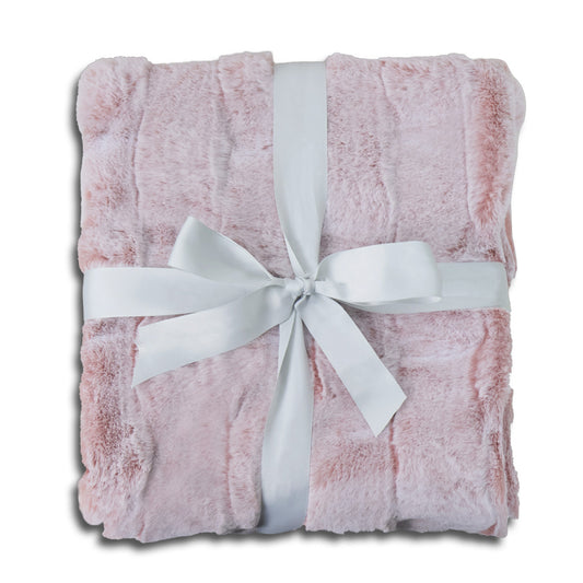 A folded soft pink plush blanket with delicate fluffy texture, elegantly wrapped with a wide white satin ribbon and tied into a bow at the center. The clean white background emphasizes the item's warmth and coziness, creating a gift-ready presentation with a harmonious pink-and-white color scheme.