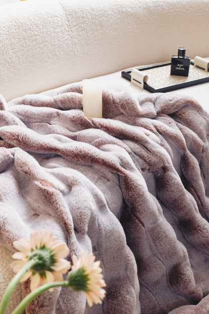 A rich brown-to-beige gradient with a faux-fur texture, tufted bobble details, and a luxe oversized fold, perfect for hygge-inspired lounging.