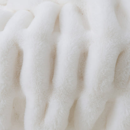 A close-up of a white plush fabric with vertical ribbed texture and velvety appearance.